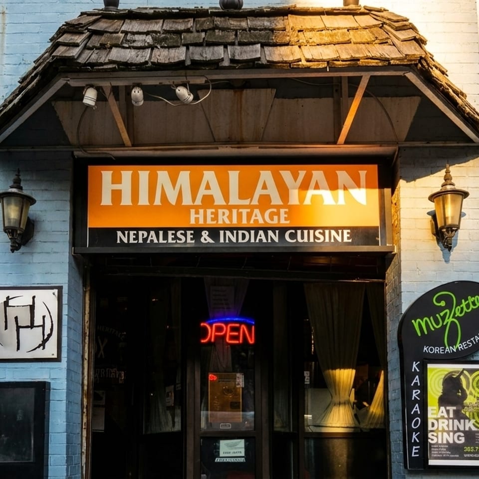 Exterior of Himalayan Heritage Nepalese & Indian Cuisine and Muzette Korean Restaurant with an "OPEN" sign.
